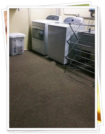 A picture of a laundry area carpetted by Carpet Warehouse