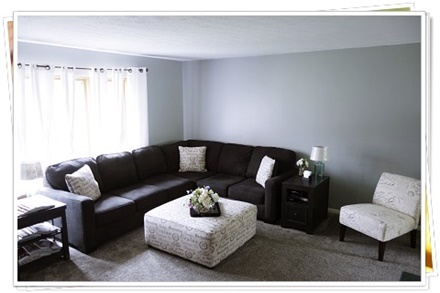a picture of a living room carpeted by Carpet Warehouse
